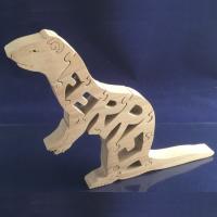 A wooden puzzle of a Ferret.